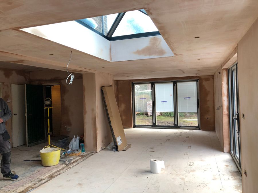 Extension interior mid-build with roof lantern installed and walls boarded