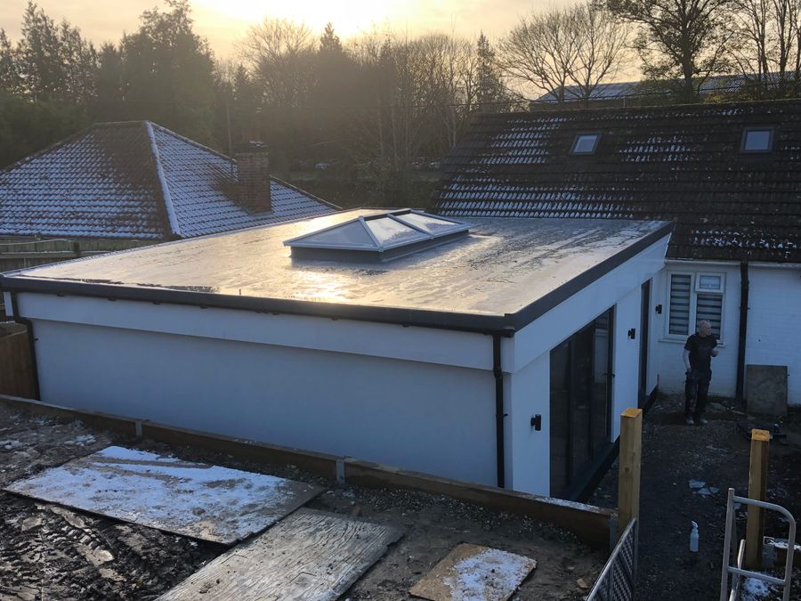 Flat roof with skylight on a nearly complete modular extension, viewed from above